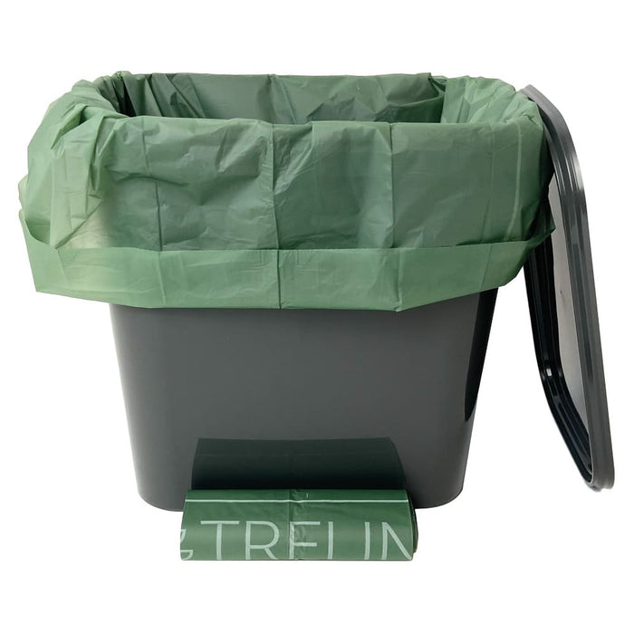 Grauer Eimer mit grüner Bioplastiktüte und Deckel.