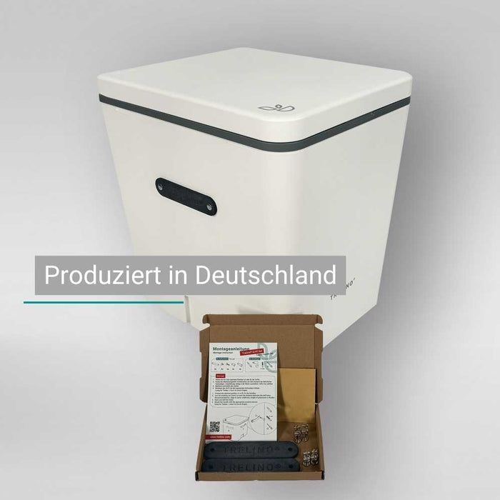 Weiße kastenförmige Trelino Trenntoilette mit robusten Ledergriffen, Teilen und Anleitung.